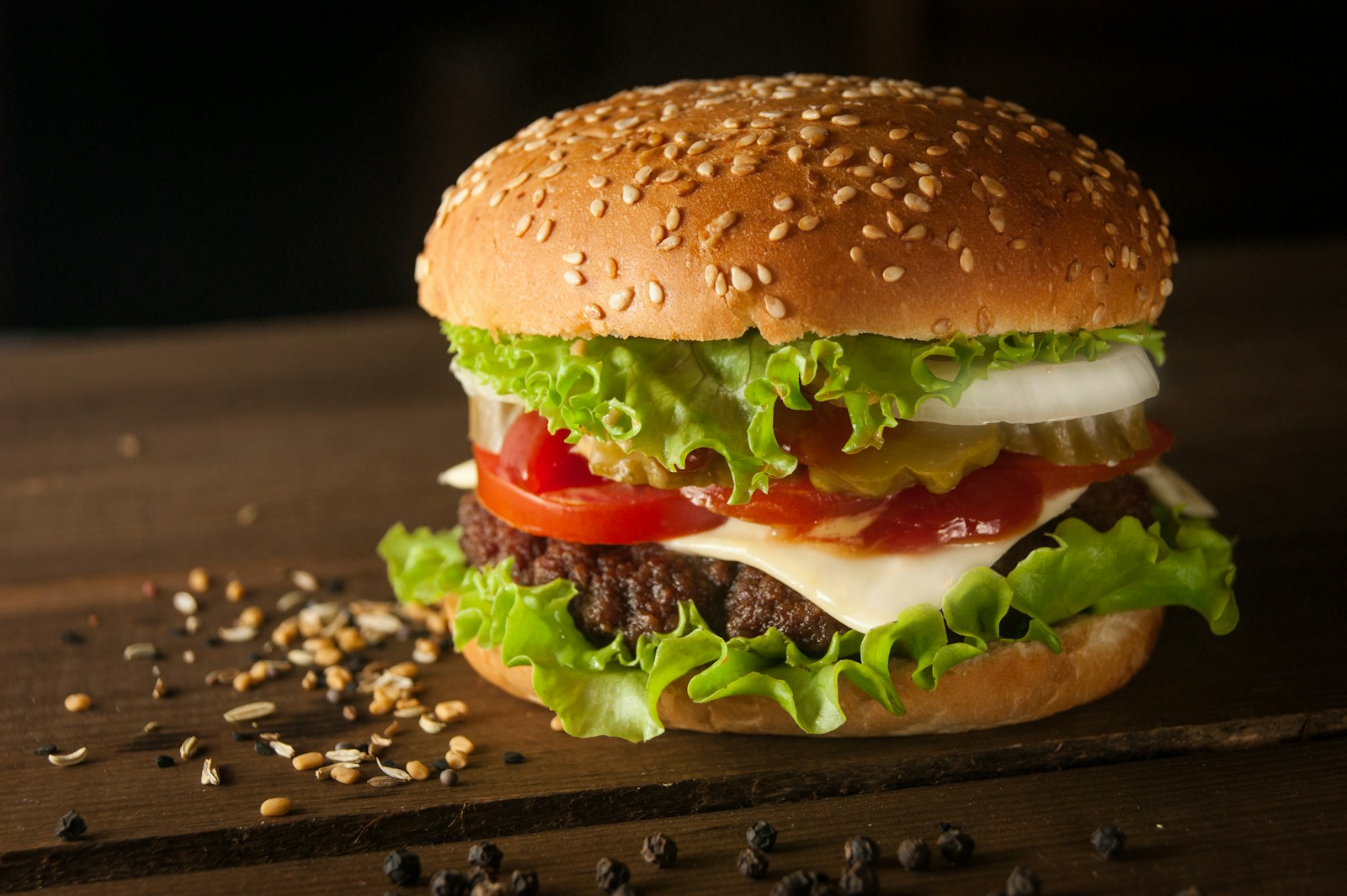 Burger and chips served on a wooden pub table